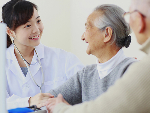 pretty young asian doctor with seniors